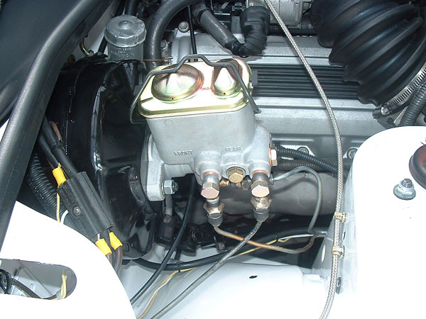 The master cylinder is from an Australian Ford Falcon (1979-81 model). It has an internal proportioning valve.