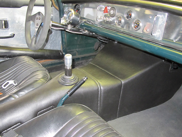 Two-piece transmission tunnel cover featuring hand-stitched Morbern Allsport stretch vinyl.
