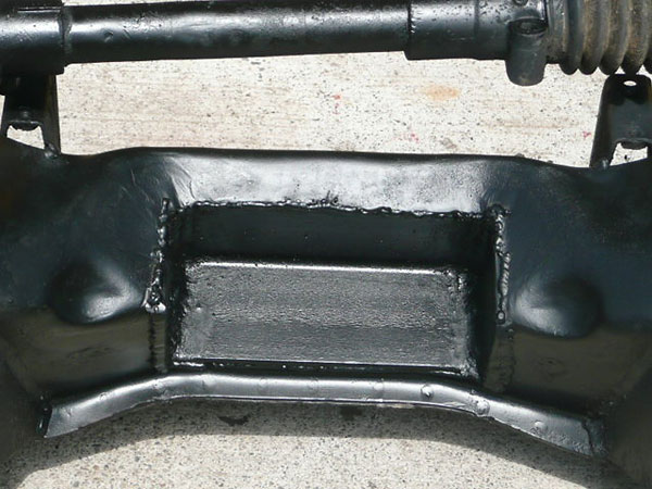 Cut-out in the MGB front crossmember to accommodate the height of the Toyota engine.