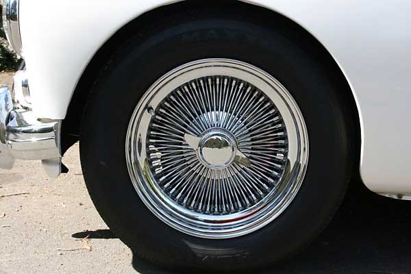 16 inch Dayton radial well-lace knockoff wheels (2-ear caps)