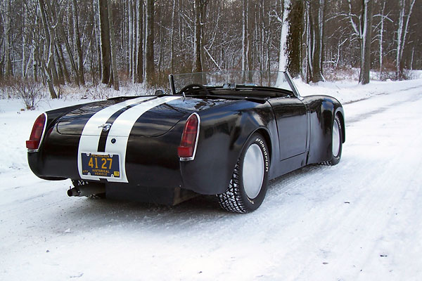 Fiberglass rear fenders with generously sized flares complete the racecar look.