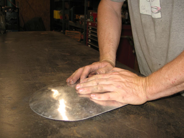At a glance it's clear that the part doesn't lay flat, so James leaned on it a bit.