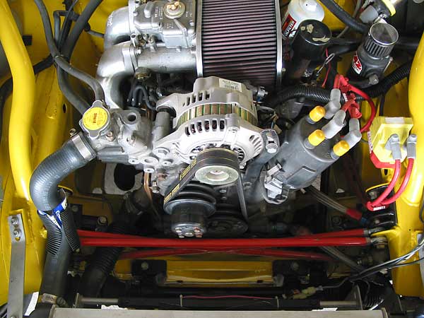 Roll cage extensions brace the engine compartment. Heim-jointed braces help too.
