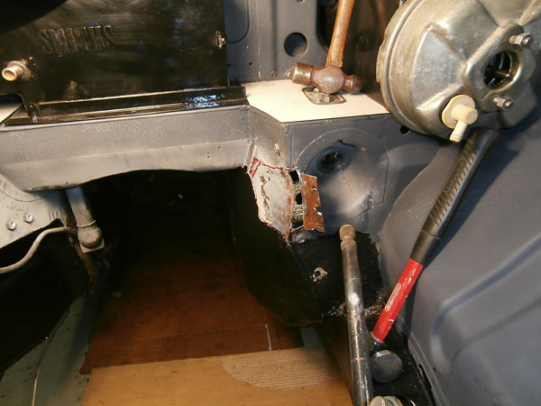 Making clearance for the driver-side cylinder head.
