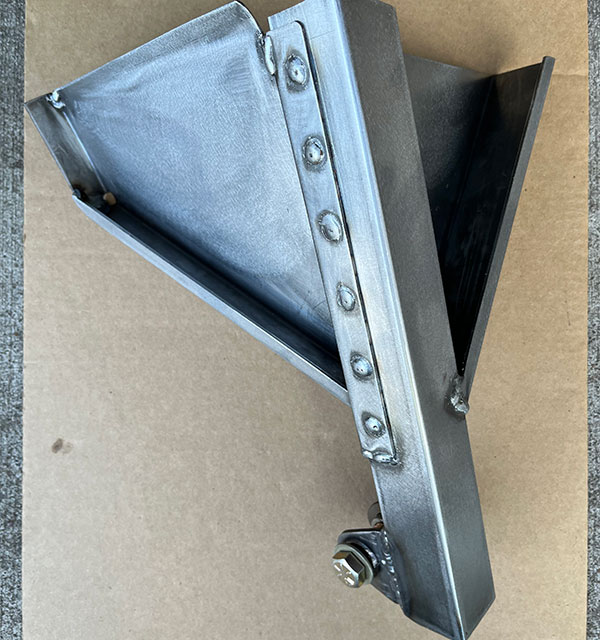 Panhard rod bracket, preassembled and ready for attachment to the MGB's body.