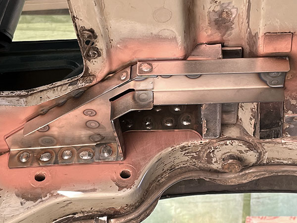 Coilover shock absorber mounting brackets, viewed from below.