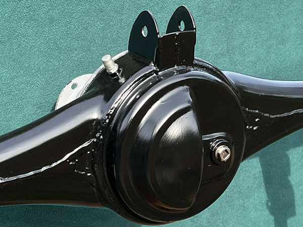 Ford threaded steel breather vent in lieu of Mazda plug-in plastic vent.