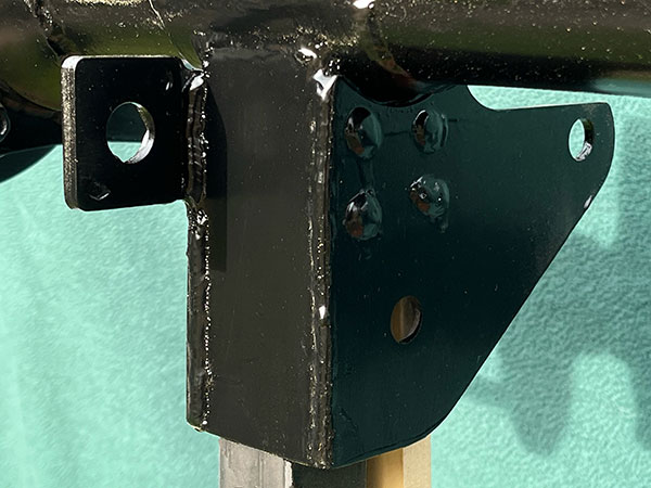 Driver side lower link / coilover bracket.