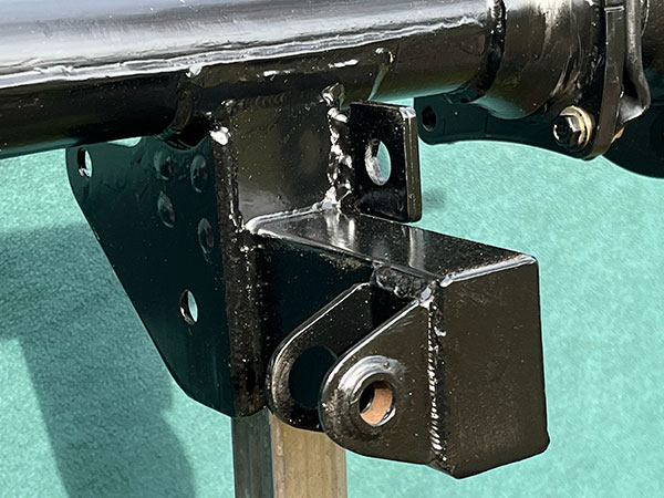 Both lower link brackets also include features for supporting brake hoses.