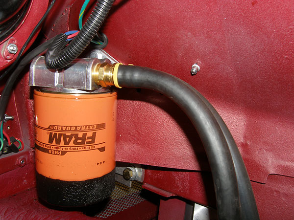 Fram PH8A oil filter, mounted under driver-side fender.