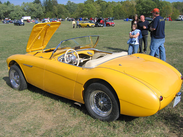 spoked wheels and louvered hood