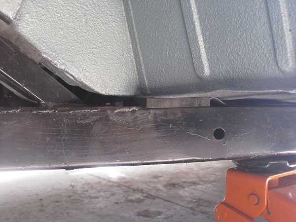 Body lifted 5/8-inch via hard rubber spacers on frame.