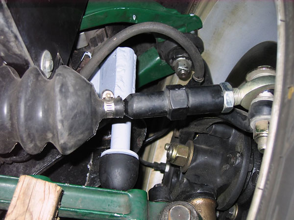 Custom bump stops have been fabricated to limit suspension travel.