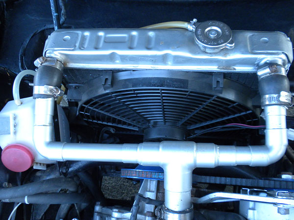 Modified stock radiator, with dual intake and outlet ports and a 4-row core.