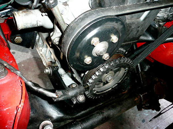 Tone wheel and Hall effect sensor for the crank-fired ignition system.